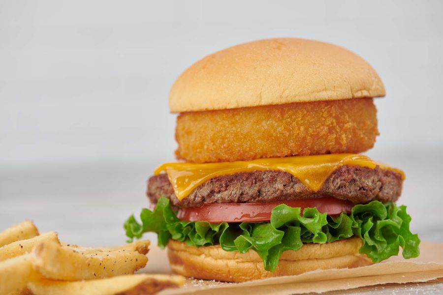 Impossible burger with an onion ring served at Hard Rock Cafe Sacramento.