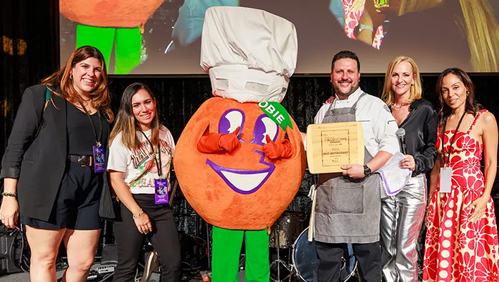 NYY Steak Receiving Award at Orange Bowl Food & Wine Celebration 2025