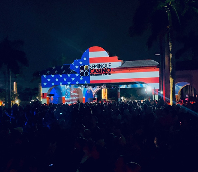 Exterior logo with 4th of July light display at Seminole Casino Coconut Creek